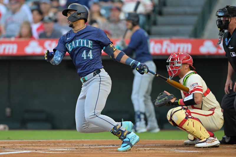 Jul 13, 2024; Anaheim, California, USA;  J.P. Julio Rodriguez #44 of the Seattle Mariners hits a RBI single in the first inning against the Los Angeles Angels at Angel Stadium. Mandatory Credit: Jayne Kamin-Oncea-USA TODAY Sports