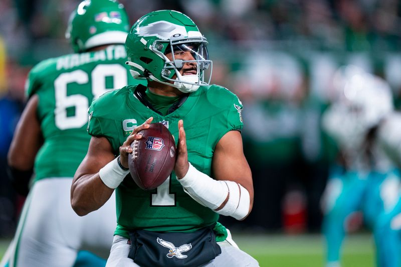 Philadelphia Eagles quarterback Jalen Hurts (1) in action during the NFL football game against the Miami Dolphins, Sunday, Oct. 22, 2023, in Philadelphia. (AP Photo/Chris Szagola)