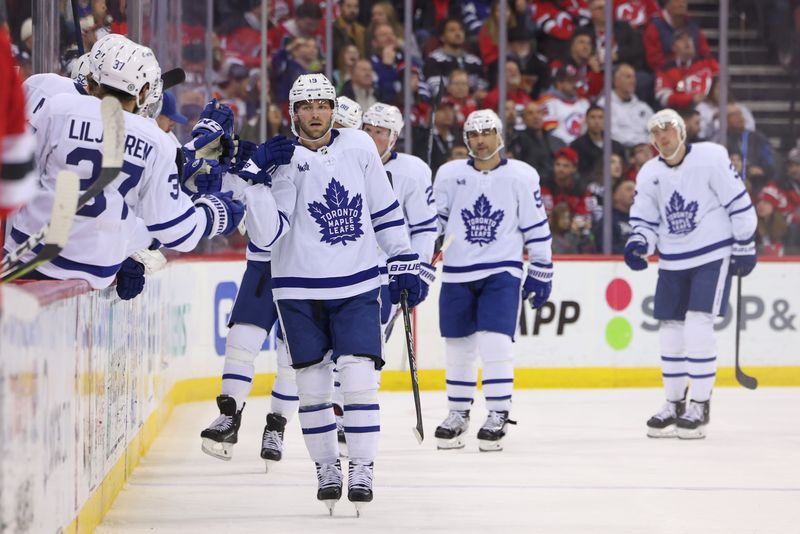 Mar 7, 2023; Newark, New Jersey, USA; Toronto Maple Leafs center Calle Jarnkrok (19) celebrates his goal against the New Jersey Devils during the second period at Prudential Center. Mandatory Credit: Ed Mulholland-USA TODAY Sports