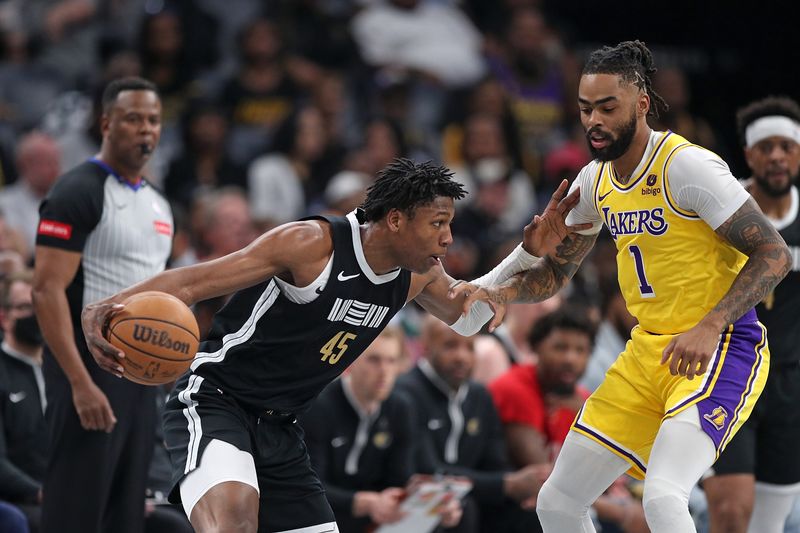 MEMPHIS, TENNESSEE - APRIL 12: GG Jackson #45 of the Memphis Grizzlies handles the ball against D'Angelo Russell #1 of the Los Angeles Lakers during the first half at FedExForum on April 12, 2024 in Memphis, Tennessee. NOTE TO USER: User expressly acknowledges and agrees that, by downloading and or using this photograph, User is consenting to the terms and conditions of the Getty Images License Agreement. (Photo by Justin Ford/Getty Images)