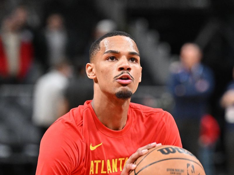 ATLANTA, GEORGIA - JANUARY 12: Dejounte Murray #5 of the Atlanta Hawks warms up before the game against the Indiana Pacers at State Farm Arena on January 12, 2024 in Atlanta, Georgia.  NOTE TO USER: User expressly acknowledges and agrees that, by downloading and or using this photograph, User is consenting to the terms and conditions of the Getty Images License Agreement. (Photo by Paras Griffin/Getty Images)