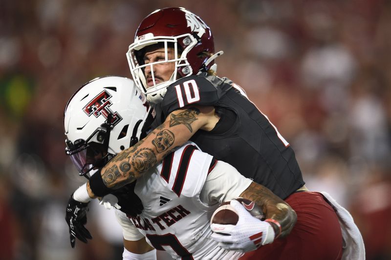 Sep 7, 2024; Pullman, Washington, USA; Texas Tech Red Raiders running back Cam'Ron Valdez (0) is caught from behind by Washington State Cougars defensive back Leyton Smithson (10) in the first half at Gesa Field at Martin Stadium. Mandatory Credit: James Snook-Imagn Images