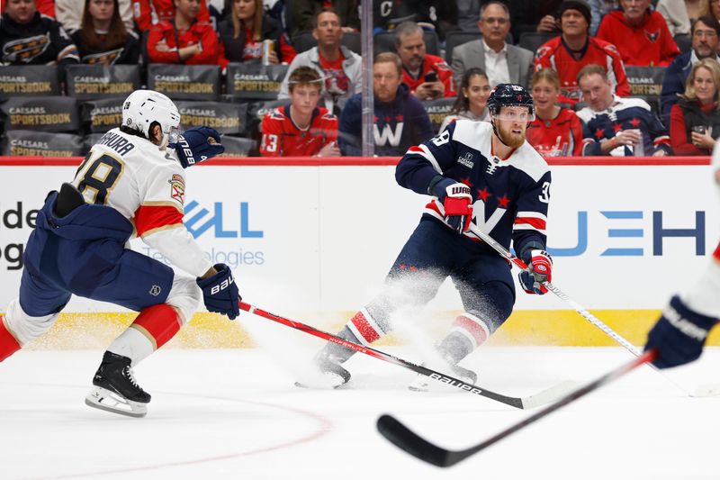 Nov 8, 2023; Washington, District of Columbia, USA; Washington Capitals right wing Anthony Mantha (39) skates with the puck as Florida Panthers defenseman Josh Mahura (28) defends in the first period at Capital One Arena. Mandatory Credit: Geoff Burke-USA TODAY Sports