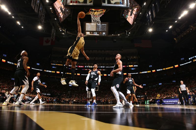 TORONTO, CANADA - JANUARY 26: Scottie Barnes #4 of the Toronto Raptors drives to the basket during the game against the LA Clippers on January 26, 2024 at the Scotiabank Arena in Toronto, Ontario, Canada.  NOTE TO USER: User expressly acknowledges and agrees that, by downloading and or using this Photograph, user is consenting to the terms and conditions of the Getty Images License Agreement.  Mandatory Copyright Notice: Copyright 2024 NBAE (Photo by Vaughn Ridley/NBAE via Getty Images)