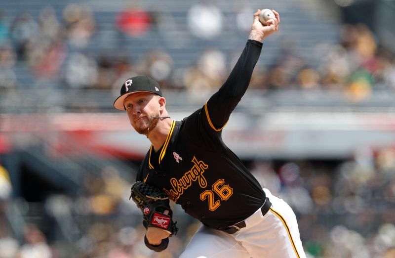 May 12, 2024; Pittsburgh, Pennsylvania, USA;  Pittsburgh Pirates starting pitcher Bailey Falter (26) delivers a pitch against the Chicago Cubs during the first inning at PNC Park. Mandatory Credit: Charles LeClaire-USA TODAY Sports