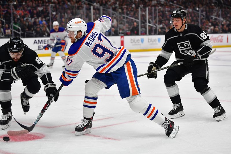 Apr 29, 2023; Los Angeles, California, USA; Los Angeles Kings defenseman Drew Doughty (8) blocks the shot of Edmonton Oilers center Connor McDavid (97) during the first period in game six of the first round of the 2023 Stanley Cup Playoffs at Crypto.com Arena. Mandatory Credit: Gary A. Vasquez-USA TODAY Sports