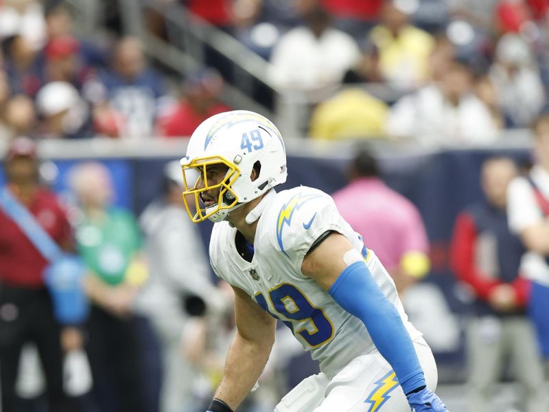 Los Angeles Chargers linebacker Drue Tranquill (49) looks to defend during an NFL football game against the Houston Texans on Sunday, October 2, 2022, in Houston. (AP Photo/Matt Patterson)