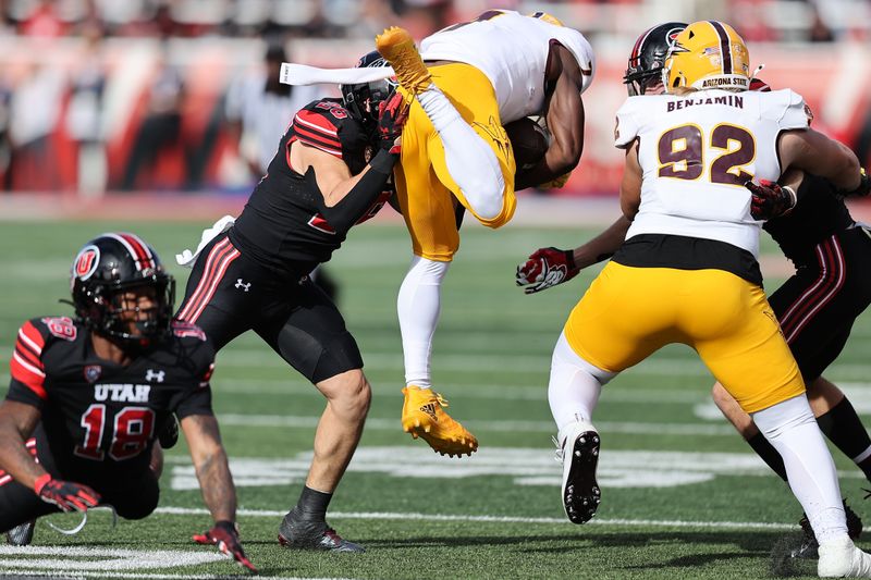 Nov 4, 2023; Salt Lake City, Utah, USA; Arizona State Sun Devils wide receiver Melquan Stovall (7) jumps into Utah Utes safety Briton Allen (26) in the third quarter at Rice-Eccles Stadium. Mandatory Credit: Rob Gray-USA TODAY Sports