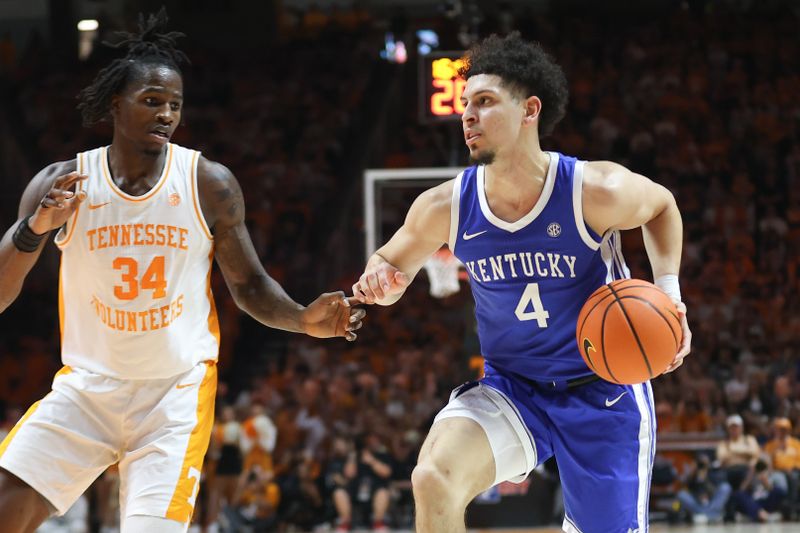 Jan 28, 2025; Knoxville, Tennessee, USA; Kentucky Wildcats guard Koby Brea (4) moves the ball against Tennessee Volunteers forward Felix Okpara (34) during the second half at Thompson-Boling Arena at Food City Center. Mandatory Credit: Randy Sartin-Imagn Images