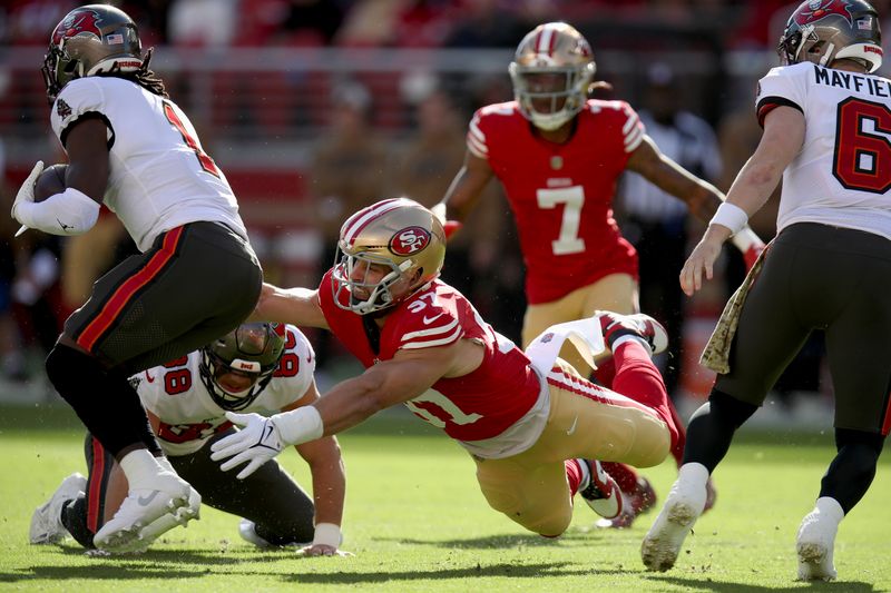 San Francisco 49ers defensive end Nick Bosa (97) rushes during an NFL football game against the Tampa Bay Buccaneers, Sunday, Nov. 19, 2023, in Santa Clara, Calif. (AP Photo/Scot Tucker)