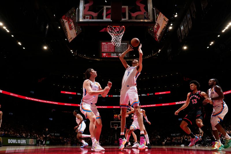 TORONTO, CANADA - MARCH 22:  Chet Holmgren #7 of the Oklahoma City Thunder grabs a rebound during the game against the Toronto Raptors on March 22, 2024 at the Scotiabank Arena in Toronto, Ontario, Canada.  NOTE TO USER: User expressly acknowledges and agrees that, by downloading and or using this Photograph, user is consenting to the terms and conditions of the Getty Images License Agreement.  Mandatory Copyright Notice: Copyright 2024 NBAE (Photo by Mark Blinch/NBAE via Getty Images)