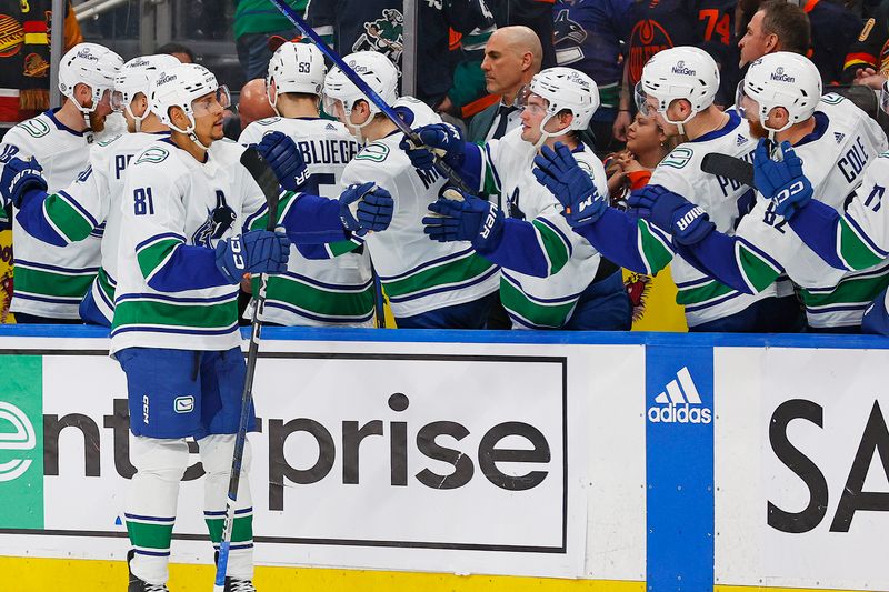 Apr 13, 2024; Edmonton, Alberta, CAN; The Vancouver Canucks celebrate a goal by  forward Dakota Joshua (81) during the third period against the Edmonton Oilers at Rogers Place. Mandatory Credit: Perry Nelson-USA TODAY Sports