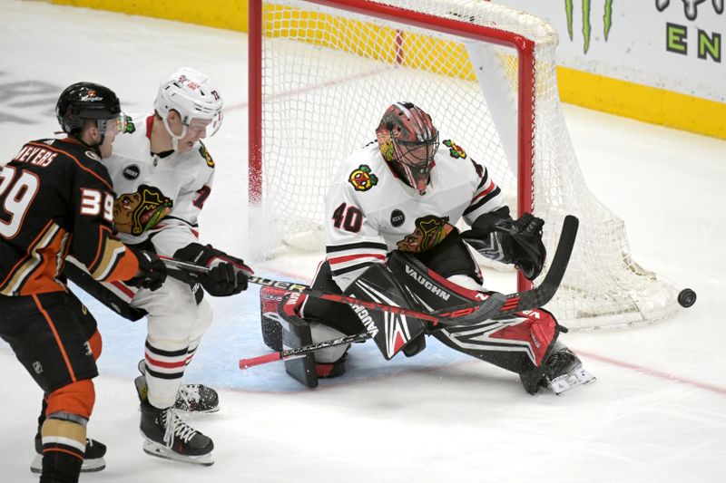 Mar 21, 2024; Anaheim, California, USA; Chicago Blackhawks defenseman Alex Vlasic (72) and goaltender Arvid Soderblom (40) defends a shot by Anaheim Ducks center Ben Meyers (39) in the first period at Honda Center. Mandatory Credit: Jayne Kamin-Oncea-USA TODAY Sports