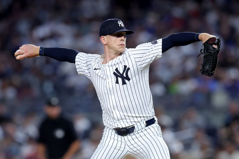 Jun 7, 2024; Bronx, New York, USA; New York Yankees relief pitcher Ian Hamilton (71) pitches against the Los Angeles Dodgers during the tenth inning at Yankee Stadium. Mandatory Credit: Brad Penner-USA TODAY Sports