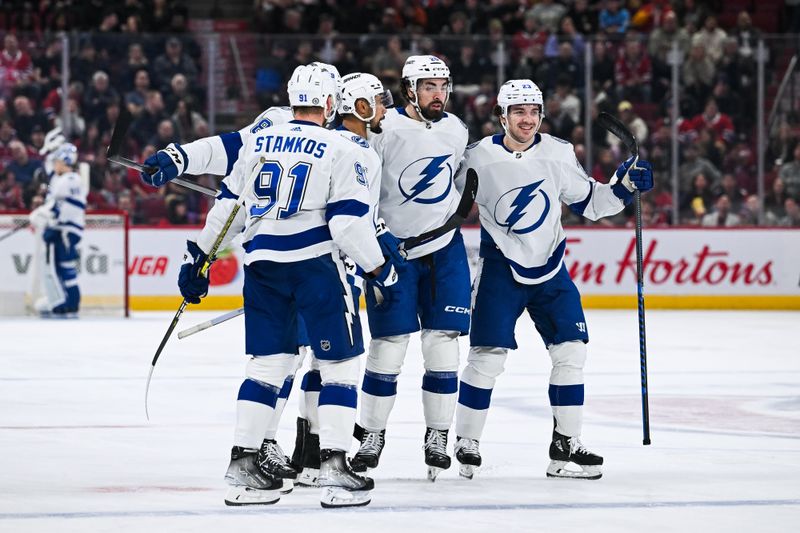 Apr 4, 2024; Montreal, Quebec, CAN;Tampa Bay Lightning left wing Nicholas Paul (20) celebrates his second goal of the game against the Montreal Canadiens with his teammates  during the second period at Bell Centre. Mandatory Credit: David Kirouac-USA TODAY Sports