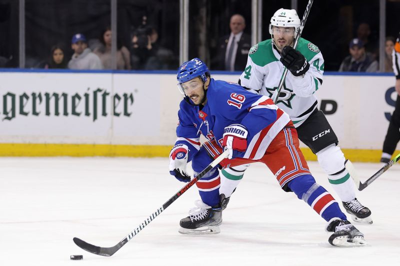 Feb 20, 2024; New York, New York, USA; New York Rangers center Vincent Trocheck (16) plays the puck against Dallas Stars defenseman Joel Hanley (44) during the first period at Madison Square Garden. Mandatory Credit: Brad Penner-USA TODAY Sports