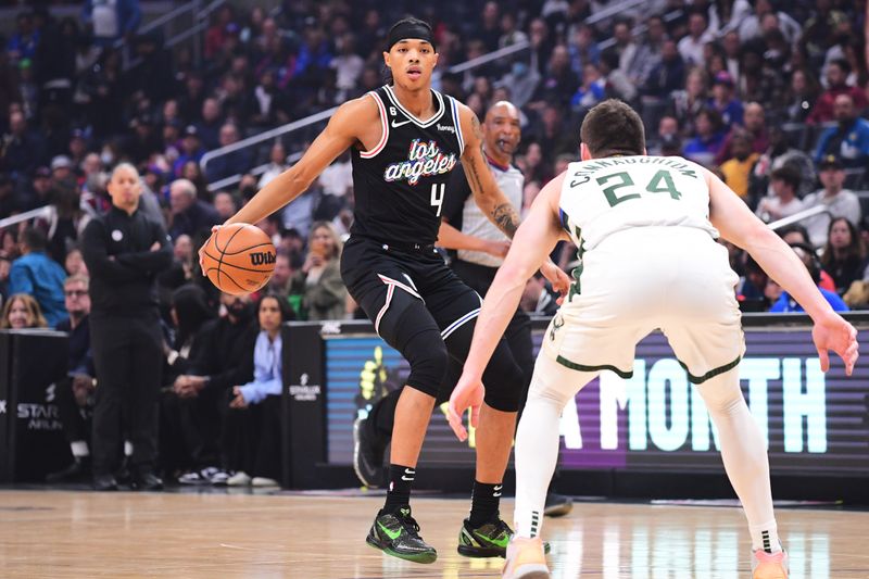 LOS ANGELES, CA - FEBRUARY 10: Brandon Boston Jr. #4 of the LA Clippers dribbles the ball during the game against the Milwaukee Bucks on February 10, 2023 at Crypto.Com Arena in Los Angeles, California. NOTE TO USER: User expressly acknowledges and agrees that, by downloading and/or using this Photograph, user is consenting to the terms and conditions of the Getty Images License Agreement. Mandatory Copyright Notice: Copyright 2023 NBAE (Photo by Adam Pantozzi/NBAE via Getty Images)