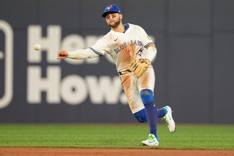 Apr 29, 2025; Toronto, Ontario, CAN; Toronto Blue Jays shortstop Bo Bichette (11) throws out Boston Red Sox left fielder Jarren Duran (not pictured) to end the top of the sixth inning at Rogers Centre. Mandatory Credit: John E. Sokolowski-Imagn Images