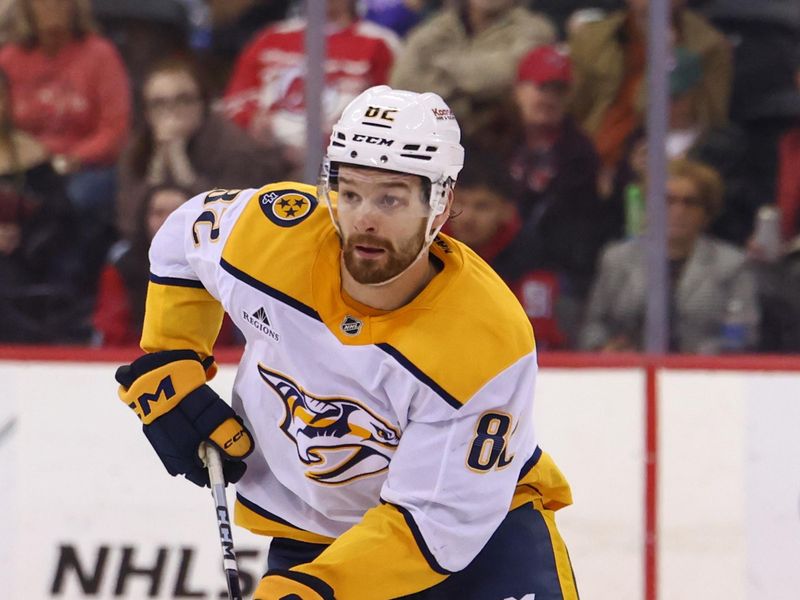 Nov 25, 2024; Newark, New Jersey, USA; Nashville Predators center Tommy Novak (82) skates with the puck against the New Jersey Devils during the third period at Prudential Center. Mandatory Credit: Ed Mulholland-Imagn Images