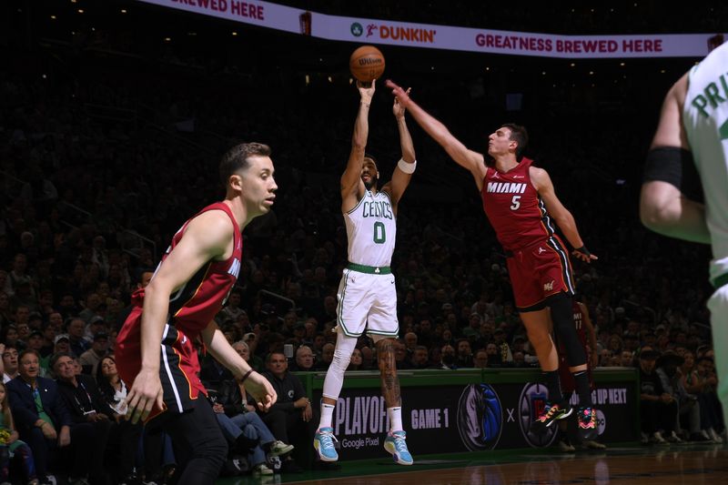 BOSTON, MA - APRIL 21: Jayson Tatum #0 of the Boston Celtics shoots a three point basket against the Miami Heat during Round 1 Game 1 of the 2024 NBA Playoffs on April 21, 2024 at the TD Garden in Boston, Massachusetts. NOTE TO USER: User expressly acknowledges and agrees that, by downloading and or using this photograph, User is consenting to the terms and conditions of the Getty Images License Agreement. Mandatory Copyright Notice: Copyright 2024 NBAE  (Photo by Brian Babineau/NBAE via Getty Images)