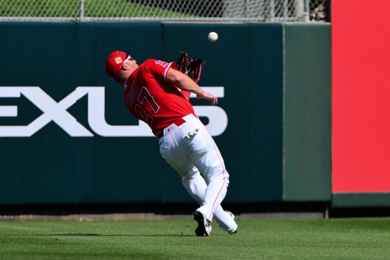 Feb 26, 2026; Tempe, Arizona, USA; Los Angeles Angels right fielder Mike Trout (27) fails to catch a a fly ball in the first inning against the Chicago Cubs at Tempe Diablo Stadium. Mandatory Credit: Matt Kartozian-Imagn Images