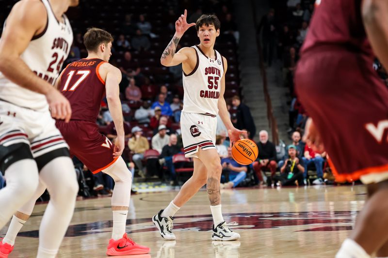 Dec 2, 2025; Columbia, South Carolina, USA; South Carolina Gamecocks guard Mike Sharavjamts (55) looks to pass against the Virginia Tech Hokies in the first half at Colonial Life Arena. Mandatory Credit: Jeff Blake-Imagn Images