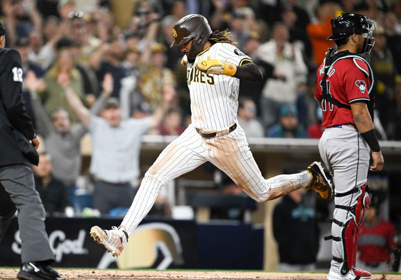 Jun 6, 2024; San Diego, California, USA; San Diego Padres right fielder Fernando Tatis Jr. (23) scores during the fifth inning against the Arizona Diamondbacks at Petco Park. Mandatory Credit: Denis Poroy-USA TODAY Sports at Petco Park. 