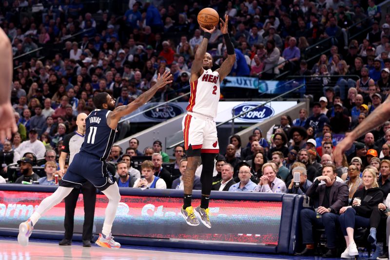 DALLAS, TEXAS - MARCH 07: Terry Rozier #2 of the Miami Heat shoots the ball while defended by Kyrie Irving #11 of the Dallas Mavericks in the first half at American Airlines Center on March 07, 2024 in Dallas, Texas.  NOTE TO USER: User expressly acknowledges and agrees that, by downloading and or using this photograph, User is consenting to the terms and conditions of the Getty Images License Agreement. (Photo by Tim Heitman/Getty Images)