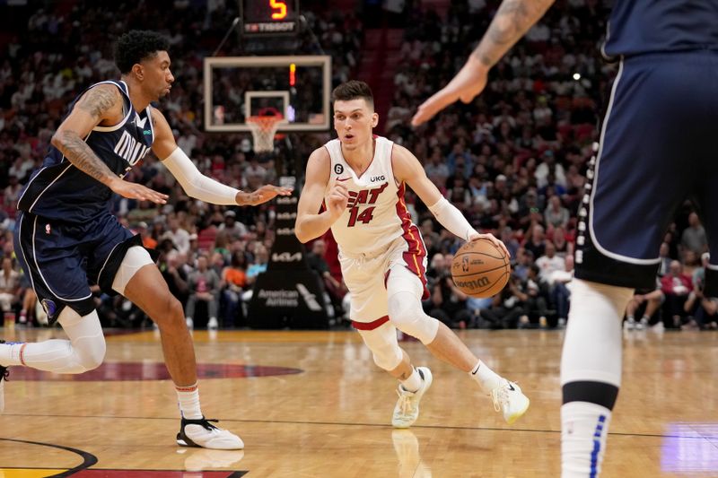 MIAMI, FL - APRIL 1:  Tyler Herro #14 of the Miami Heat drives to the basket against the Dallas Mavericks on April 1, 2023 at FTX Arena in Miami, Florida. NOTE TO USER: User expressly acknowledges and agrees that, by downloading and or using this Photograph, user is consenting to the terms and conditions of the Getty Images License Agreement. Mandatory Copyright Notice: Copyright 2023 NBAE (Photo by Issac Baldizon/NBAE via Getty Images)