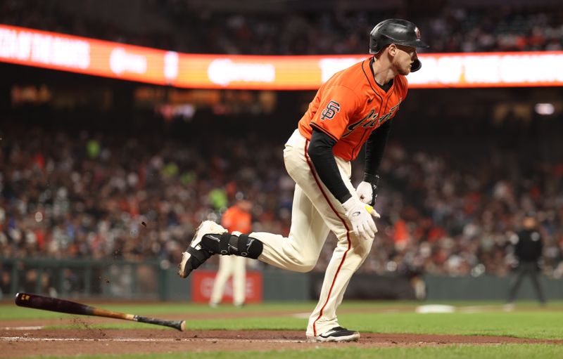 May 2, 2025; San Francisco, California, USA; San Francisco Giants catcher Sam Huff (23) runs for a single against the Colorado Rockies during the fourth inning at Oracle Park. Mandatory Credit: Kelley L Cox-Imagn Images