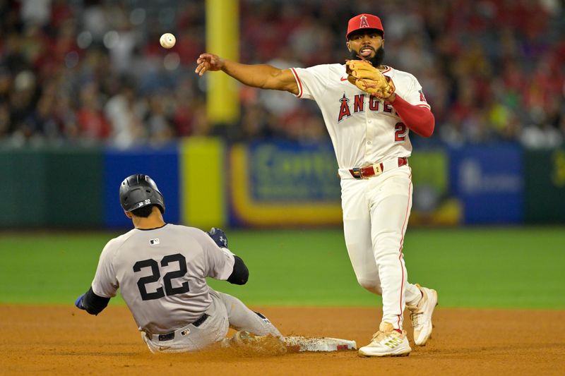 May 29, 2024; Anaheim, California, USA;  Los Angeles Angels second baseman Luis Rengifo (2) throws to first as New York Yankees right fielder Juan Soto (22) is out on a double play in the ninth inning at Angel Stadium. Mandatory Credit: Jayne Kamin-Oncea-USA TODAY Sports