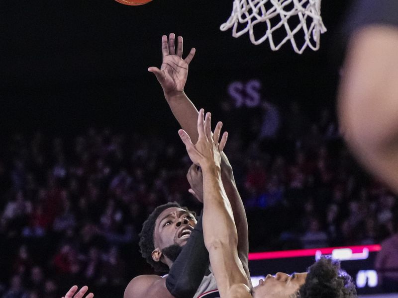 Feb 17, 2024; Athens, Georgia, USA; Georgia Bulldogs guard Noah Thomasson (3) shoots over Florida Gators guard Zyon Pullin (0) during the first half at Stegeman Coliseum. Mandatory Credit: Dale Zanine-USA TODAY Sports