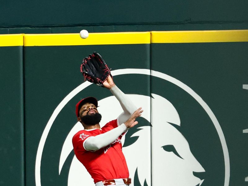 Aug 27, 2025; Arlington, Texas, USA;  Los Angeles Angels right fielder Jo Adell (7) makes a catch during the fourth inning against the Texas Rangers at Globe Life Field. Mandatory Credit: Kevin Jairaj-Imagn Images