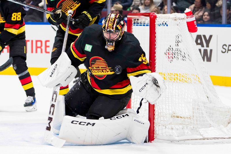 Dec 12, 2023; Vancouver, British Columbia, CAN; Vancouver Canucks goalie Thatcher Demko (35) makes a save against the Tampa Bay Lightning in the third period at Rogers Arena. Vancouver won 4-1. Mandatory Credit: Bob Frid-USA TODAY Sports