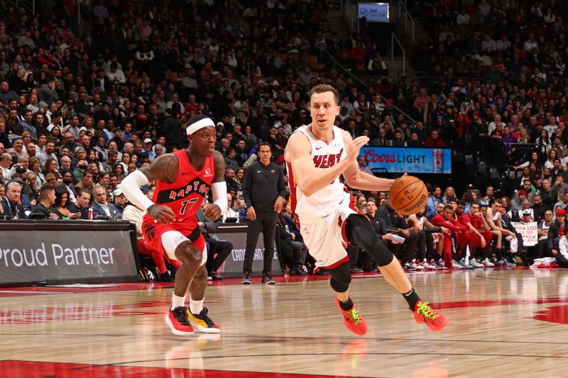 TORONTO, CANADA - JANUARY 17: Duncan Robinson #55 of the Miami Heat drives to the basket during the game against the Toronto Raptors on January 17, 2024 at the Scotiabank Arena in Toronto, Ontario, Canada.  NOTE TO USER: User expressly acknowledges and agrees that, by downloading and or using this Photograph, user is consenting to the terms and conditions of the Getty Images License Agreement.  Mandatory Copyright Notice: Copyright 2024 NBAE (Photo by Vaughn Ridley/NBAE via Getty Images)