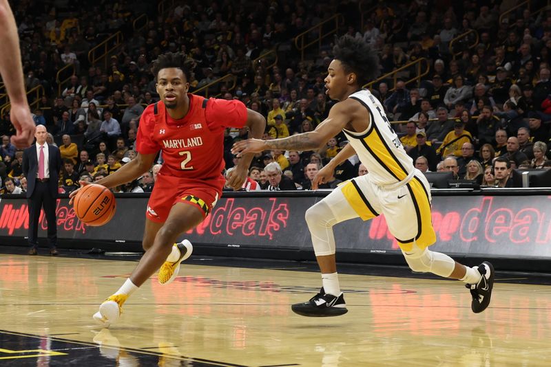 Jan 15, 2023; Iowa City, Iowa, USA; Maryland Terrapins guard Jahari Long (2) is defended by Iowa Hawkeyes guard Dasonte Bowen (5) at Carver-Hawkeye Arena. Mandatory Credit: Reese Strickland-USA TODAY Sports