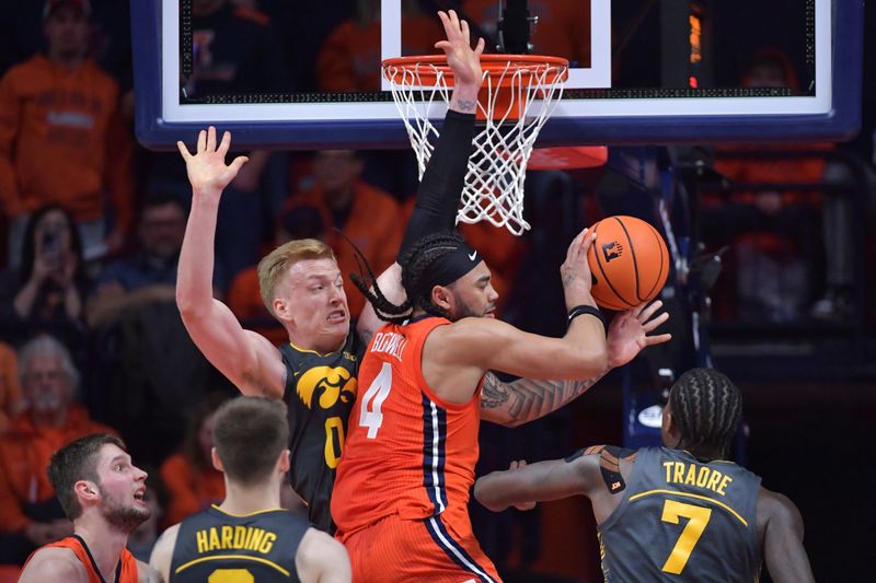 Feb 25, 2025; Champaign, Illinois, USA;  Illinois Fighting Illini guard Kylan Boswell (4) drives to the basket as Iowa Hawkeyes forward Even Brauns (0) blocks the way during the second half at State Farm Center. Mandatory Credit: Ron Johnson-Imagn Images