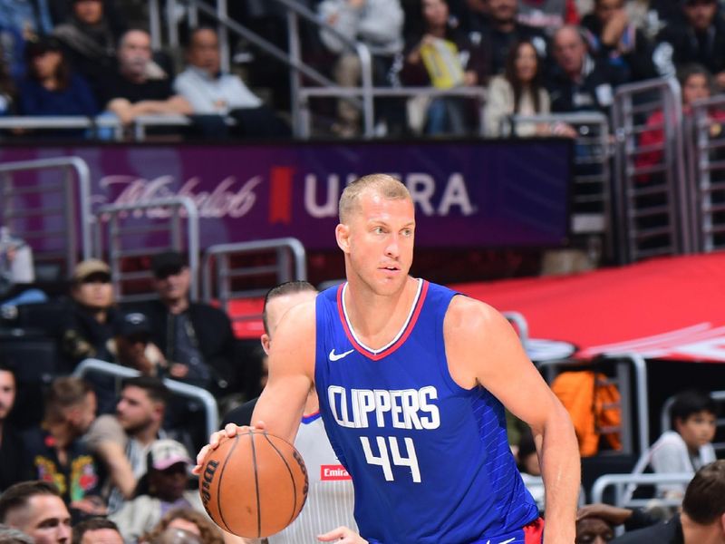 LOS ANGELES, CA - APRIL 12: Mason Plumlee #44 of the LA Clippers dribbles the ball during the game against the Utah Jazz on April 12, 2024 at Crypto.Com Arena in Los Angeles, California. NOTE TO USER: User expressly acknowledges and agrees that, by downloading and/or using this Photograph, user is consenting to the terms and conditions of the Getty Images License Agreement. Mandatory Copyright Notice: Copyright 2024 NBAE (Photo by Adam Pantozzi/NBAE via Getty Images)