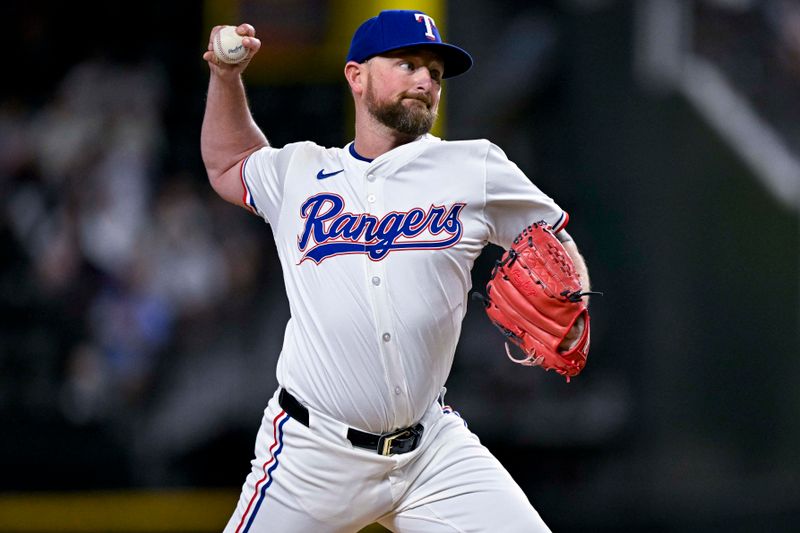 Aug 15, 2024; Arlington, Texas, USA; Texas Rangers relief pitcher Kirby Yates (39) pitches against the Minnesota Twins during the ninth inning at Globe Life Field. Mandatory Credit: Jerome Miron-USA TODAY Sports