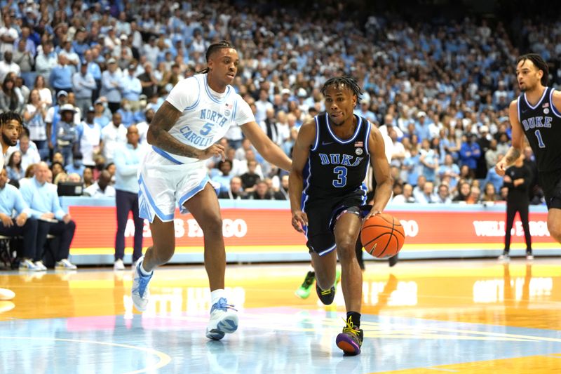 Mar 4, 2023; Chapel Hill, North Carolina, USA;  Duke Blue Devils guard Jeremy Roach (3) dribbles as North Carolina Tar Heels forward Armando Bacot (5) defends in the first half at Dean E. Smith Center. Mandatory Credit: Bob Donnan-USA TODAY Sports