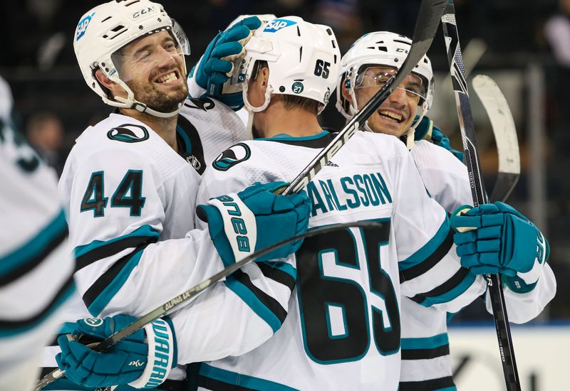 Oct 20, 2022; New York, New York, USA; San Jose Sharks defenseman Erik Karlsson (65) embraces defenseman Marc-Edouard Vlasic (44) after he scored the game-winning goal in overtime against the New York Rangers at Madison Square Garden. Mandatory Credit: Danny Wild-USA TODAY Sports