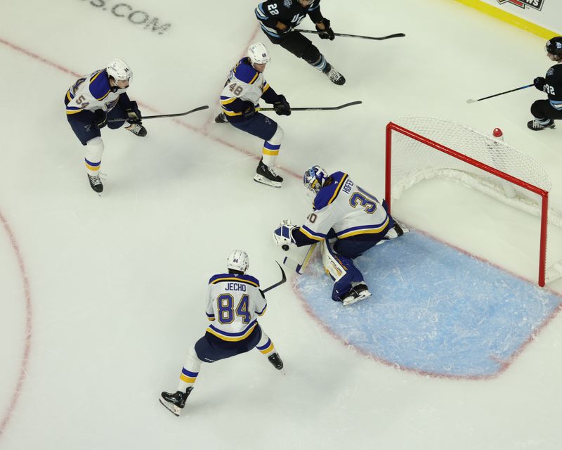 Sep 22, 2024; Des Moines, Iowa, USA; St. Louis Blues goaltender Joel Hofer (30) makes a save against the Utah Hockey Club at Wells Fargo Arena. Mandatory Credit: Reese Strickland-Imagn Images

