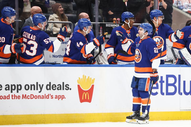 Mar 4, 2025; Elmont, New York, USA;  New York Islanders center Kyle Palmieri (21) is greeted by his teammates after scoring a goal in the first period against the Winnipeg Jets at UBS Arena. Mandatory Credit: Wendell Cruz-Imagn Images