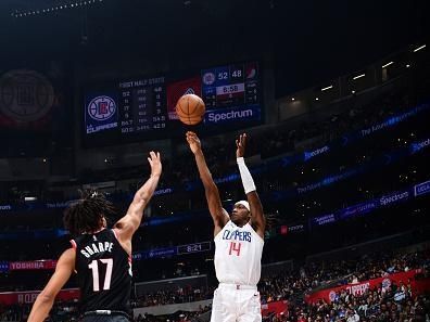 LOS ANGELES, CA - DECEMBER 11: Terance Mann #14 of the LA Clippers shoots a three point basket against the Portland Trail Blazers  on December 11, 2023 at Crypto.Com Arena in Los Angeles, California. NOTE TO USER: User expressly acknowledges and agrees that, by downloading and/or using this Photograph, user is consenting to the terms and conditions of the Getty Images License Agreement. Mandatory Copyright Notice: Copyright 2023 NBAE (Photo by Adam Pantozzi/NBAE via Getty Images)