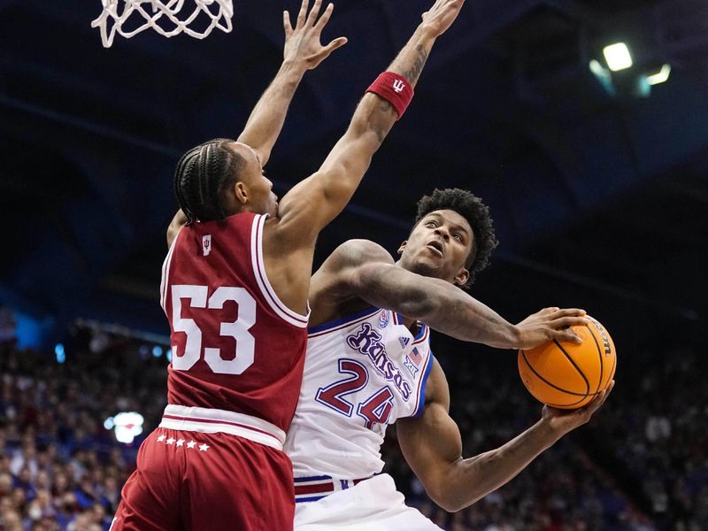 Dec 17, 2022; Lawrence, Kansas, USA; Kansas Jayhawks forward K.J. Adams Jr. (24) shoots against Indiana Hoosiers guard Tamar Bates (53) during the second half at Allen Fieldhouse. Mandatory Credit: Jay Biggerstaff-USA TODAY Sports