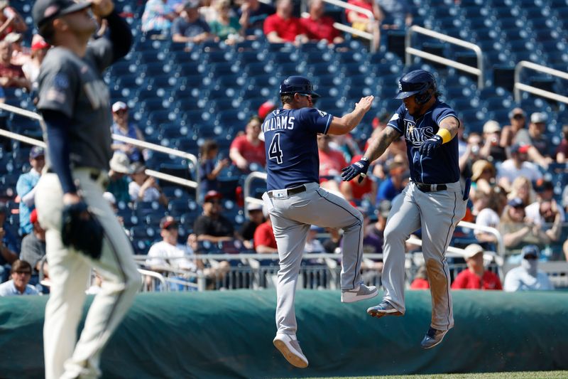 Apr 5, 2023; Washington, District of Columbia, USA; Tampa Bay Rays left fielder Harold Ramirez (43) celebrates with Rays third base coach Brady Williams (4) while rounding the bases after hitting a home run against the Washington Nationals during the sixth inning at Nationals Park. Mandatory Credit: Geoff Burke-USA TODAY Sports