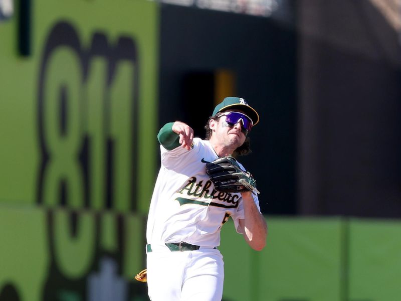 Sep 14, 2025; West Sacramento, California, USA; Athletics shortstop Jacob Wilson (5) throws to first base for an out against the Cincinnati Reds during the ninth inning at Sutter Health Park. Mandatory Credit: Dennis Lee-Imagn Images