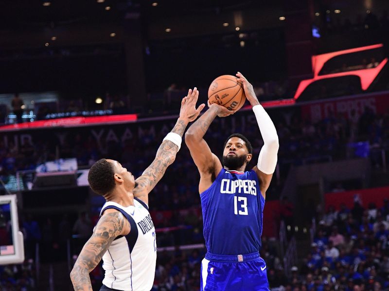 LOS ANGELES, CA - APRIL 21:  Paul George #13 of the LA Clippers shoots a three point basket against the Dallas Mavericks during Round 1 Game 1 of the 2024 NBA Playoffs on April 21, 2024 at Crypto.Com Arena in Los Angeles, California. NOTE TO USER: User expressly acknowledges and agrees that, by downloading and/or using this Photograph, user is consenting to the terms and conditions of the Getty Images License Agreement. Mandatory Copyright Notice: Copyright 2024 NBAE (Photo by Adam Pantozzi/NBAE via Getty Images)