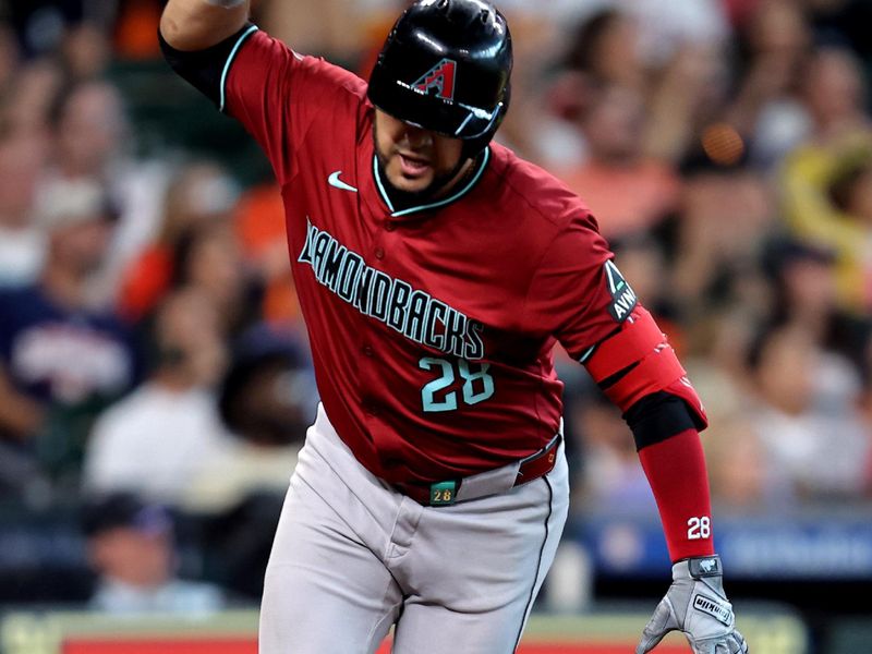 Sep 7, 2024; Houston, Texas, USA; Arizona Diamondbacks third baseman Eugenio Suárez (28) reacts after hitting a fly ball for an out against the Houston Astros during the seventh inning at Minute Maid Park. Mandatory Credit: Erik Williams-Imagn Images
