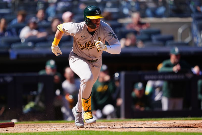 Apr 22, 2024; Bronx, New York, USA; Oakland Athletics left fielder Seth Brown (15) runs out a single against the New York Yankees during the eighth inning at Yankee Stadium. Mandatory Credit: Gregory Fisher-USA TODAY Sports